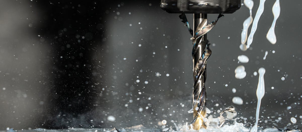 Close-up of diamond core drill bit segments and cutting edge inspection